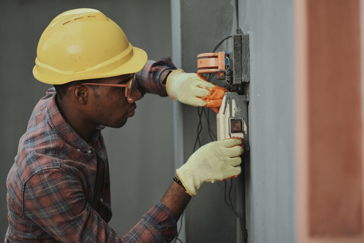 Licensed electrician contractor at a residential electrical panel